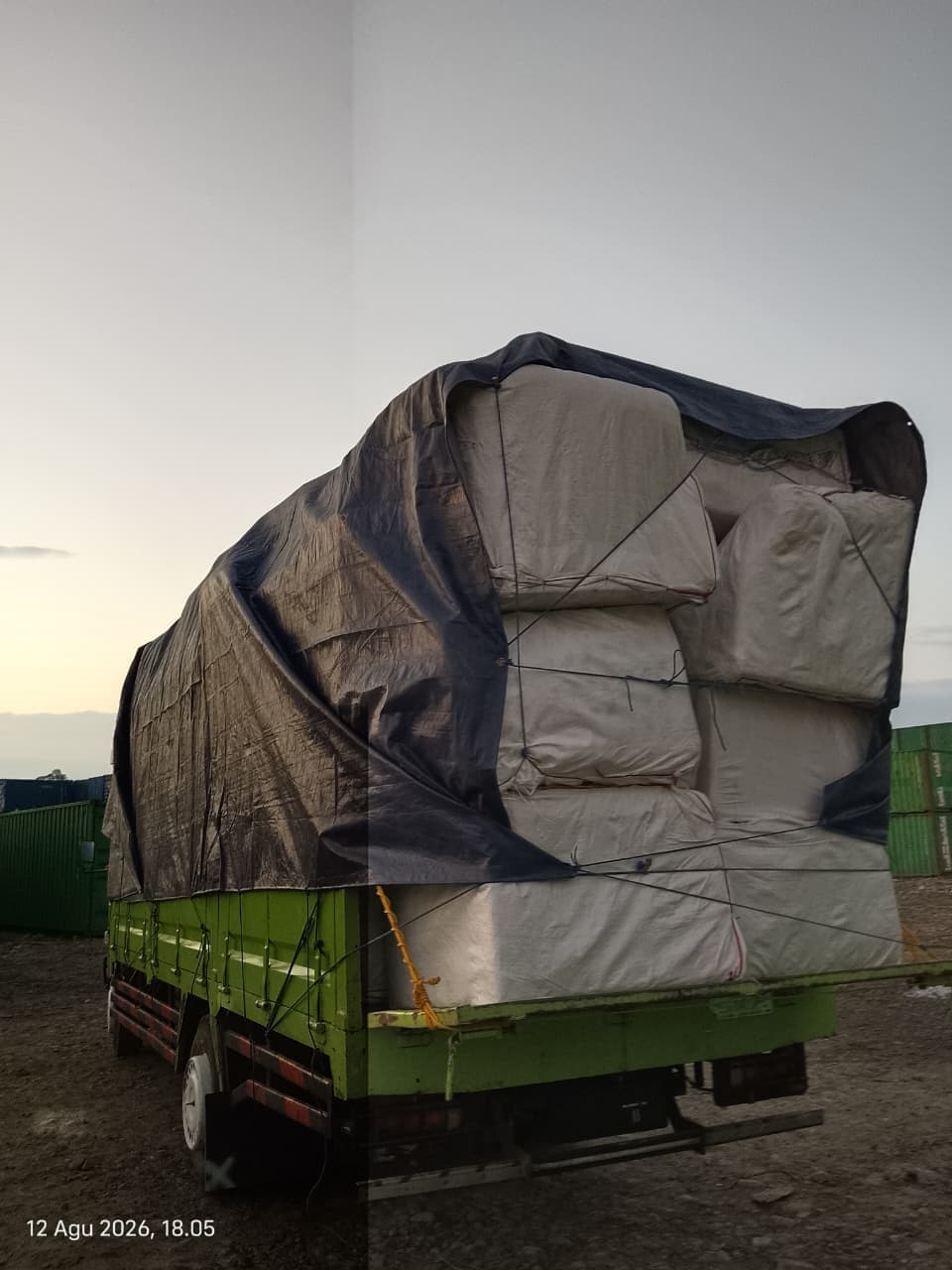 Armada truk bak tertutup siap berangkat menuju lokasi tujuan
